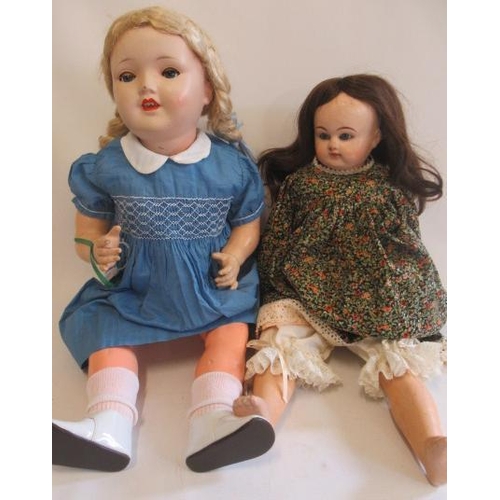 127 - Two dolls, comprising a Sonneburg Polizenfabrik 1930s socket head, with blue glass sleeping eyes, op... 