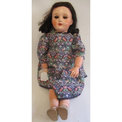 130 - An SFBJ composition socket head doll, with blue sleeping eyes, open mouth, brown wig, wood and compo... 