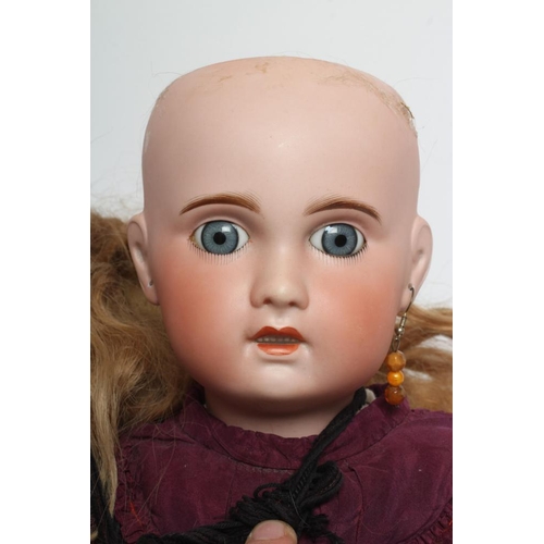 138 - An SFBJ bisque socket head doll, with blue glass fixed eyes, open mouth, moulded teeth, pierced ears... 