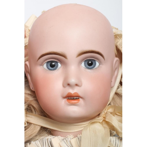 144 - A Tete Jumeau bisque socket head doll, with blue glass fixed eyes, open mouth, moulded teeth, pierce... 