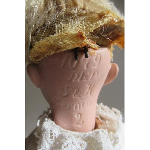 146 - A Simon & Halbig bisque socket head doll, with brown glass sleeping eyes, open mouth, teeth, pierced... 