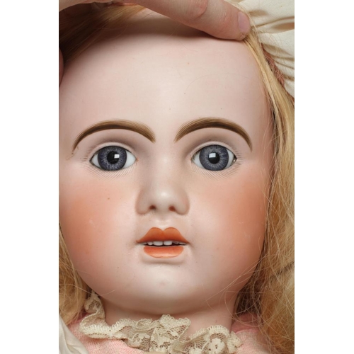 151 - A large Tete Jumeau bisque socket head doll, with blue glass fixed eyes, open mouth, teeth, pierced ... 