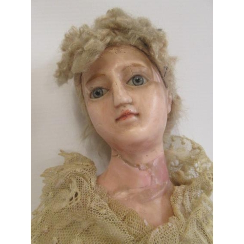 154 - A Victorian wax shoulder head doll, with blue glass fixed eyes, closed mouth, blond wig, wax lower a... 