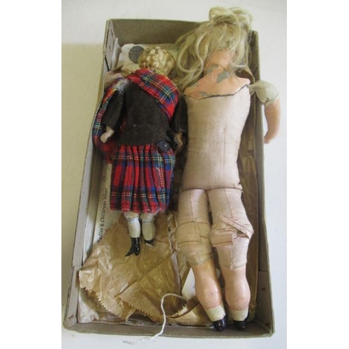 155 - Two antique dolls comprising a 10