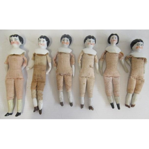 167 - Six china head miniature dolls, with moulded hair, painted features, bisque lower limbs and fabric b... 