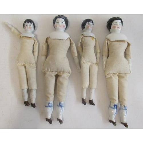 171 - Four china head dolls, made of two pairs, with moulded hair, with ceramic lower limbs, moulded boots... 