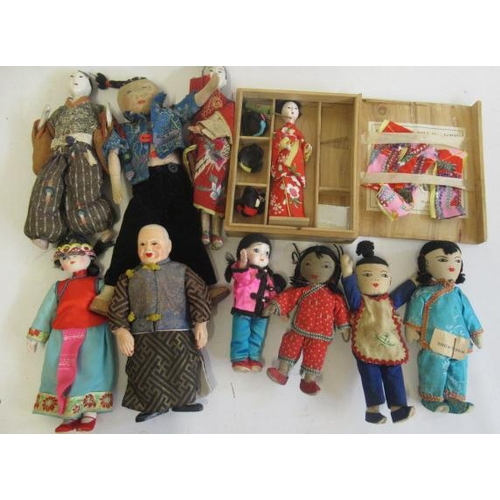 18 - A collection of oriental dolls, comprising three pre-war opera dolls  in original costumes, a boxed ... 