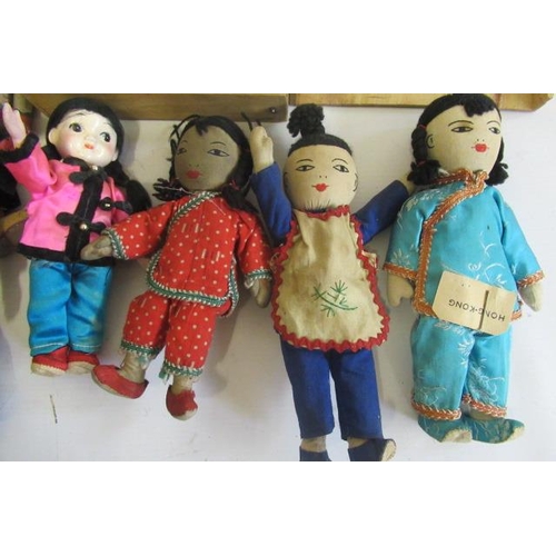 18 - A collection of oriental dolls, comprising three pre-war opera dolls  in original costumes, a boxed ... 