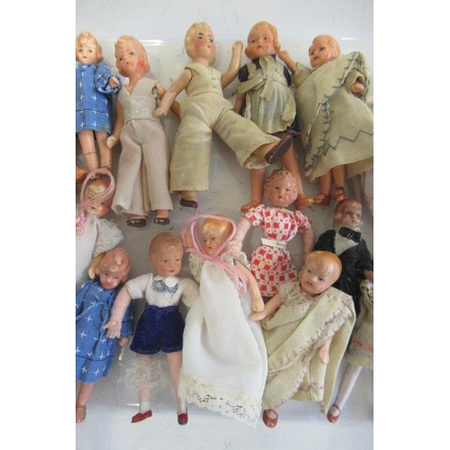 188 - A large quantity of miniature and doll's house dolls, including composition and bisque examples, all... 