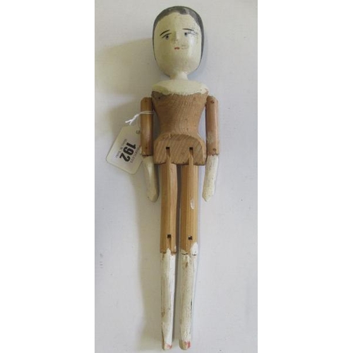 192 - A Victorian peg doll, of jointed wood construction, with painted face, hands and feet, 11 1/4