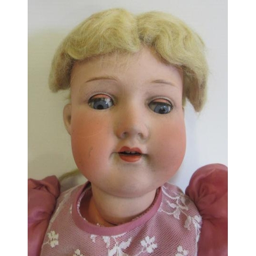 2 - An Armand Marseille bisque socket head doll, with blue glass sleeping eyes, open mouth, teeth, blond... 