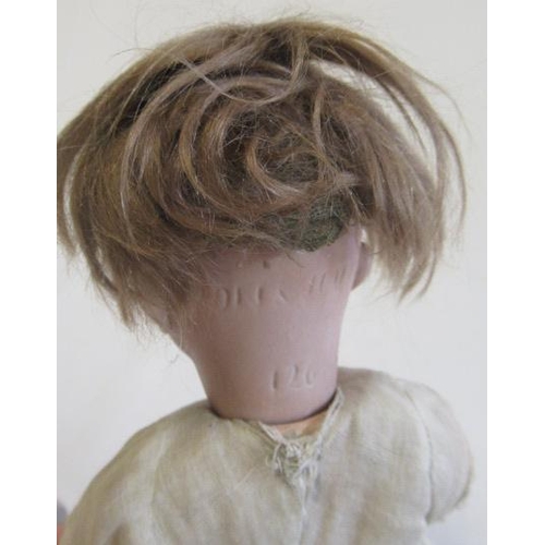 20 - A Kammer & Reinhardt bisque socket head doll, with brown glass eyes, open mouth, teeth, brown wig, w... 