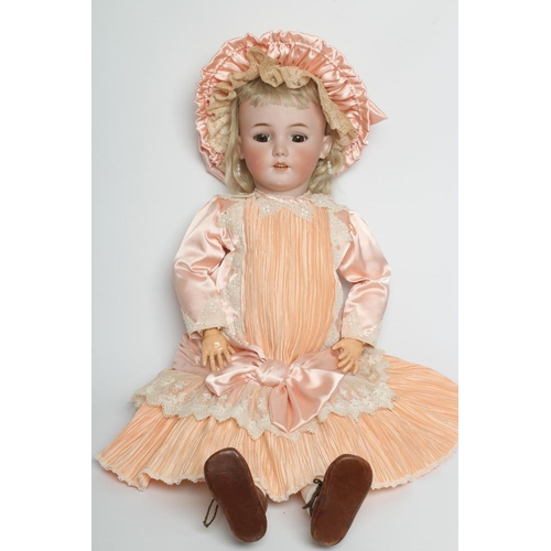 200 - A large Simon & Halbig bisque socket head doll, with brown glass sleeping eyes, open mouth, teeth, p... 