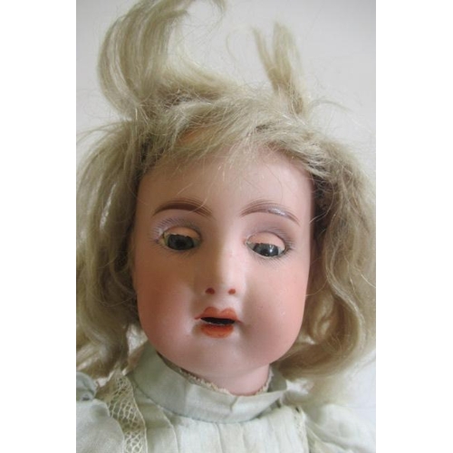 201 - A possible Jumeau bisque socket head doll, with blue glass sleeping eyes, open mouth, teeth, pierced... 