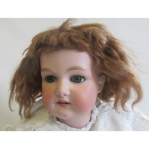 203 - A large Armand Marseille bisque socket head doll, c.1880, with blue glass sleeping eyes, open mouth,... 