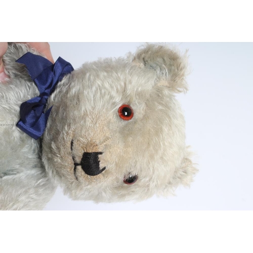 220 - A rare pair of Chiltern blue teddy bears, both with blue plush, amber eyes, sewn noses and cloth pad... 