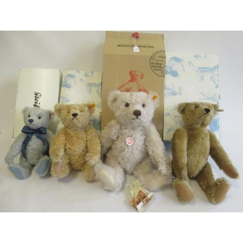 244 - Four boxed Steiff bears, comprising a 42cm classic bear, a 33cm blond bear, a 41cm orange light brow... 