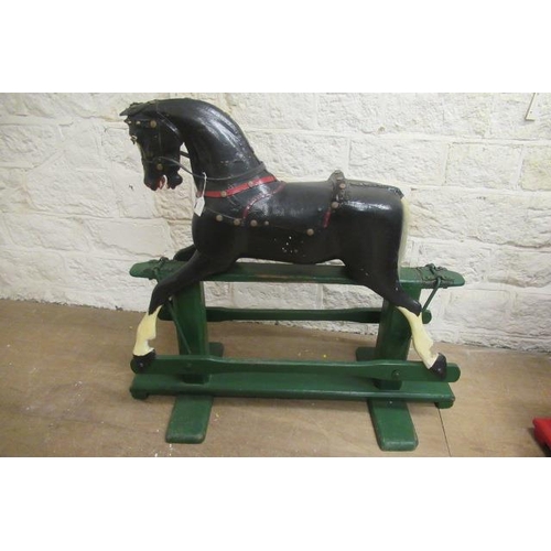 304 - An antique rocking horse 