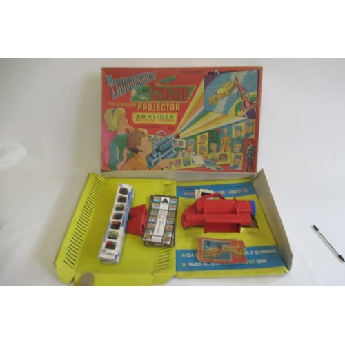 356 - Chad Valley Thunderbirds and Stringray projector with thirty two slides, box AF, contents F (Est. pl... 