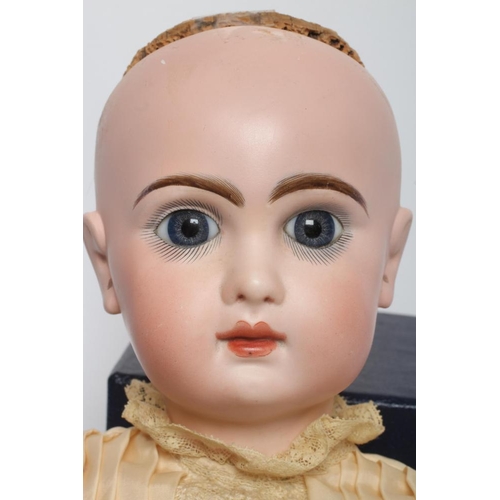 38 - A Tete Jumeau bisque socket head doll, with blue glass fixed eyes, closed mouth, pierce ears, brown ... 