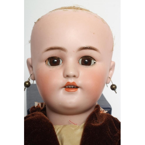 39 - A Simon & Halbig bisque socket head doll, with brown glass sleeping eyes, open mouth, teeth, pierced... 