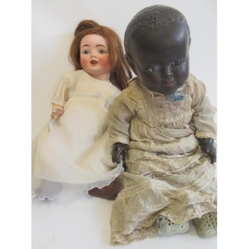 4 - Two bisque socket head dolls, comprising a Catterfelder Puppenfabrik character doll, with blue glass... 