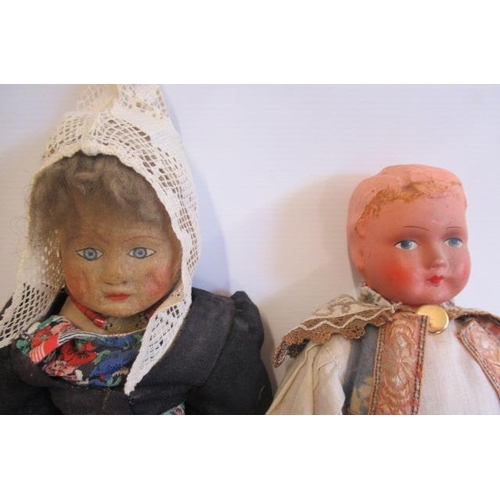 44 - Three vintage Dutch dolls, comprising one with papier mache head, one of all cloth construction and ... 