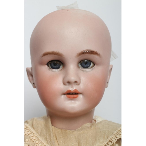 46 - A Tete Jumeau bisque socket head doll, with blue glass sleeping eyes, open mouth, moulded teeth, pie... 