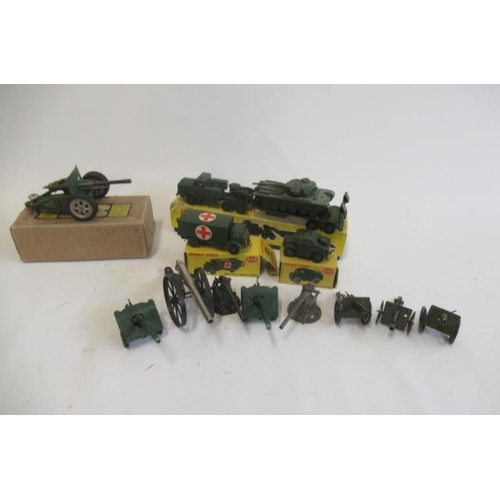 489 - Military models by Dinky, Britains and others including tank transporter, ambulance and field guns, ... 