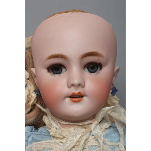 54 - A Tete Jumeau bisque socket head doll, with blue glass sleeping eyes, open mouth, moulded teeth, pie... 