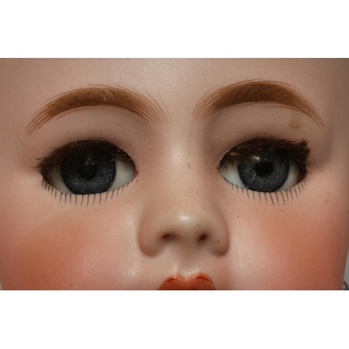 54 - A Tete Jumeau bisque socket head doll, with blue glass sleeping eyes, open mouth, moulded teeth, pie... 