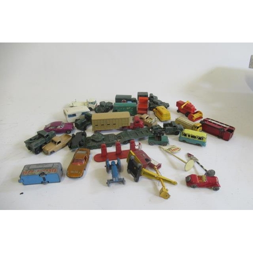 542 - Playworn Matchbox vehicles including tractor, army trucks and petrol pumps, some items damaged or ov... 