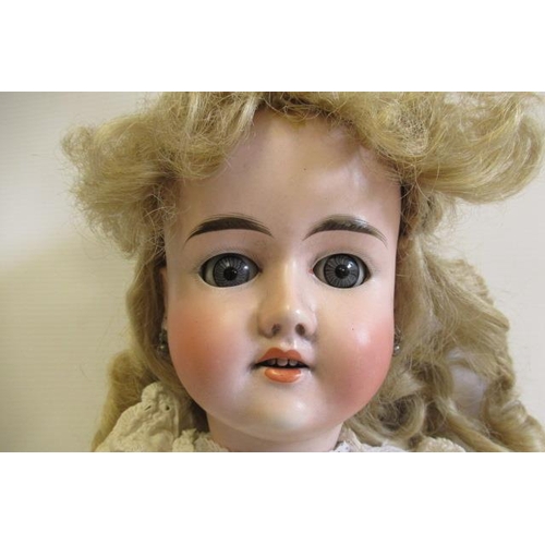 63 - A Gebruder Knoch bisque socket head doll, with blue glass sleeping eyes, open mouth, teeth, pierced ... 