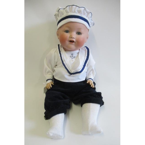 65 - An Armand Marseille bisque socket head character boy doll, with blue glass sleeping eyes, open mouth... 