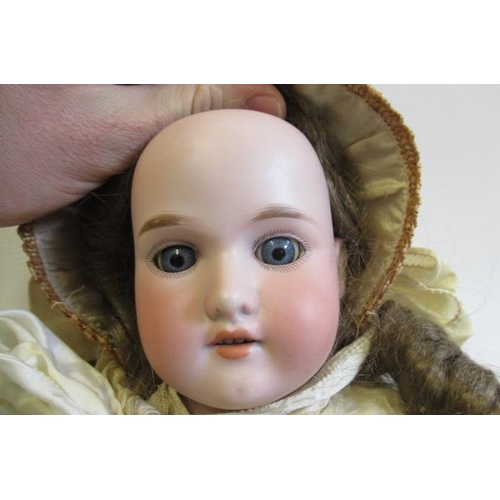 68 - A Florodora Armand Marseille bisque shoulder head doll, with blue glass sleeping eyes, open mouth, t... 