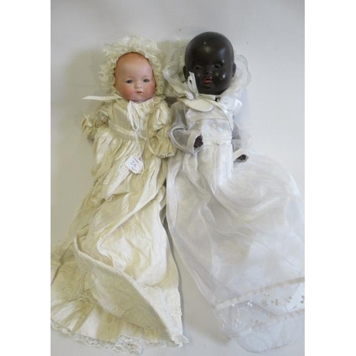 72 - Two baby dolls, comprising a 14