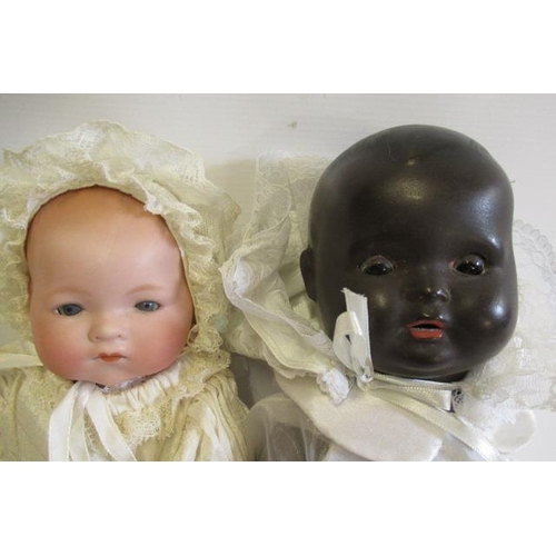 72 - Two baby dolls, comprising a 14