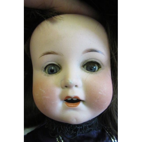 73 - An Armand Marseille bisque socket head doll, with blue glass sleeping eyes, open mouth, applied teet... 