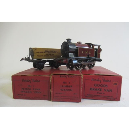 739 - Hornby clockwork 101 L.M.S. tank locomotive and three No 1 good trucks, some items boxed, F-G (Est. ... 