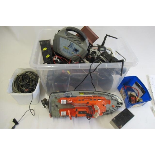 755 - Radio control equipment and 12v dry-cell batteries and charger, together with a small R.C. life boat... 