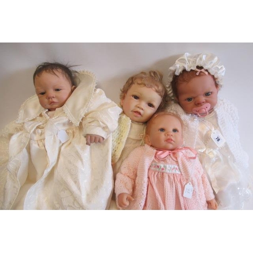 78 - Four Ashton Drake dolls, with vinyl/silicone heads and soft bodies, all with open blue eyes, largest... 