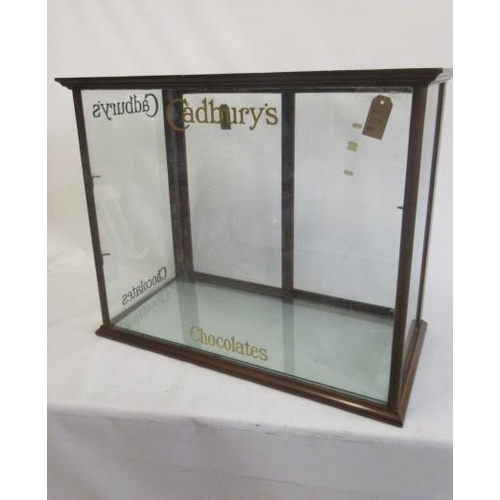 783 - A fine quality Cadbury's Chocolate Shop display cabinet, wood frame with glass infill sliding door a... 