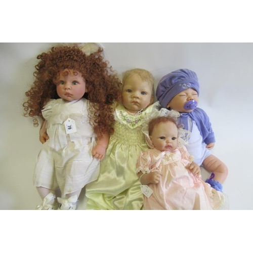 79 - Four dolls comprising a Lee Middleton Reva doll and three Ashton Drake dolls, one drake example with... 