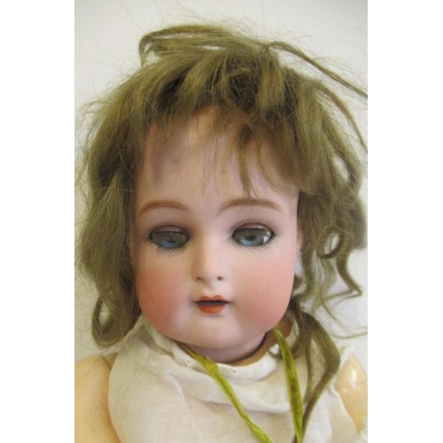 88 - A Kammer & Reinhardt bisque socket head doll, with blue glass sleeping eyes, open mouth, teeth, pier... 