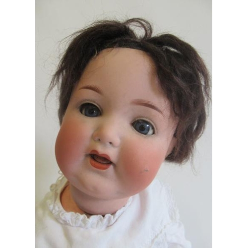 90 - An Armand Marseille bisque socket head character doll, with blue glass sleeping eyes, open mouth, qu... 