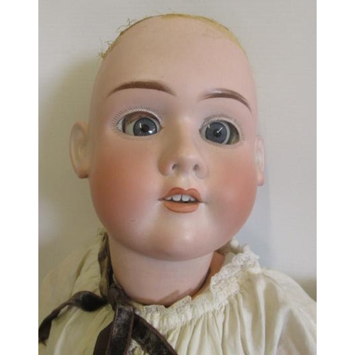 91 - Three bisque head dolls, comprising a 28