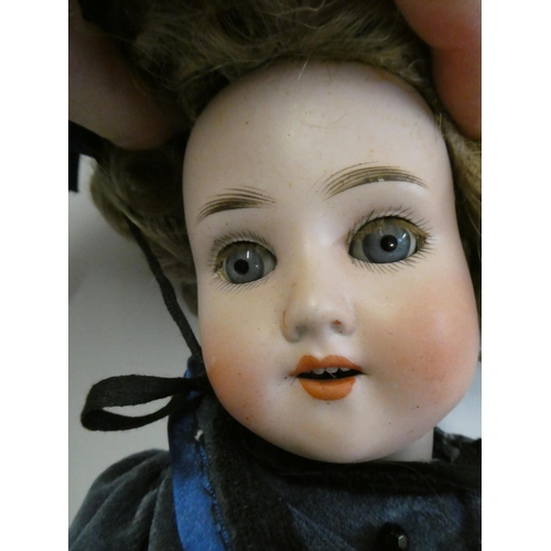 25 - A Schoenau & Hoffmeister bisque socket head doll, blue glass sleeping eyes, open mouth, teeth, blond... 