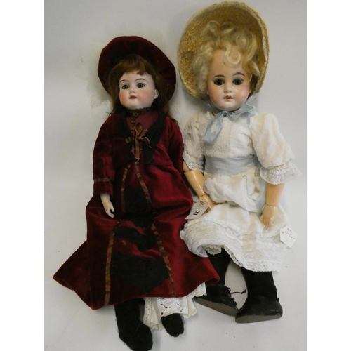 27 - Two Armand Marseille bisque head dolls, comprising a socket head girl, with blue glass sleeping eyes... 