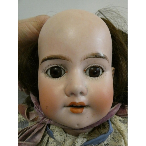 29 - An Armand Marseille bisque socket head doll, with brown glass sleeping eyes, open mouth, teeth, brow... 