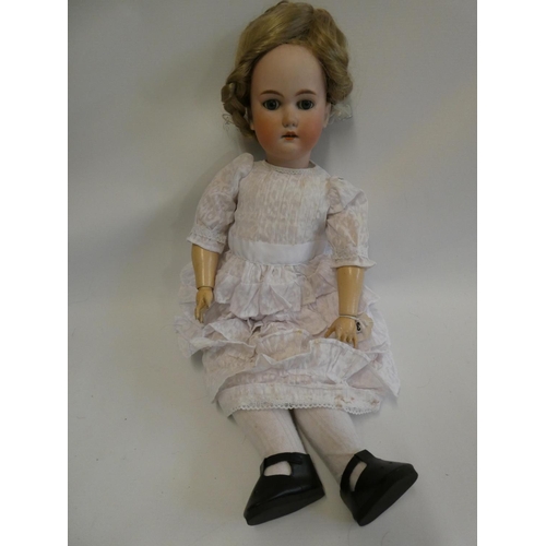 35 - A C. M. Bergmann bisque socket head doll, with blue glass sleeping eyes, open mouth, teeth, blond wi... 